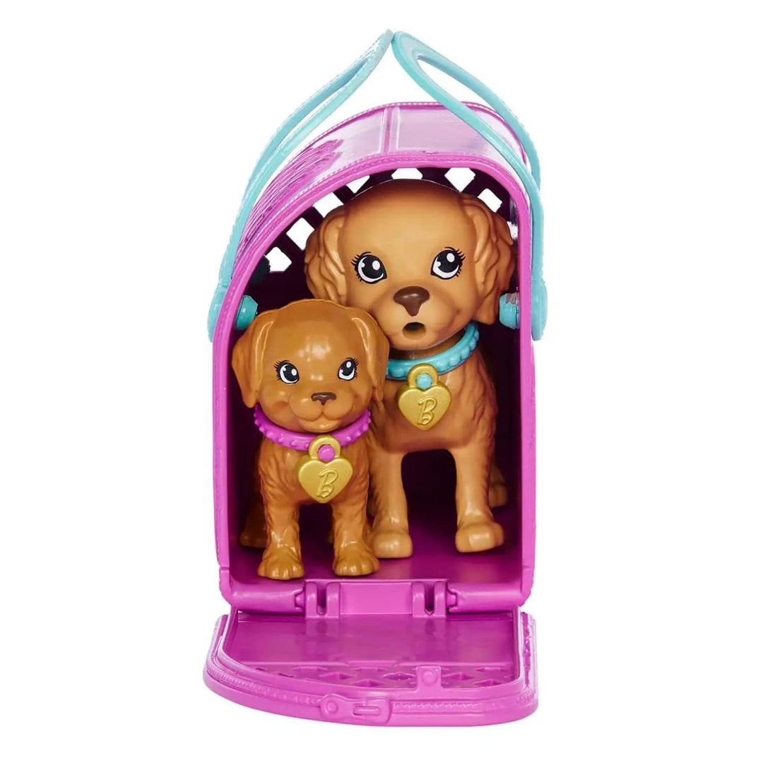 2 puppies sitting inside Barbie pet carrier