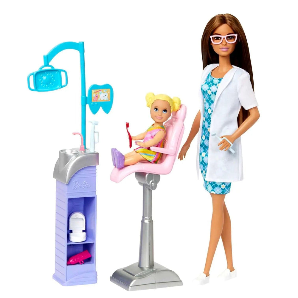 Barbie doll with white dentist coat, toddler doll in dentist chair and dental station