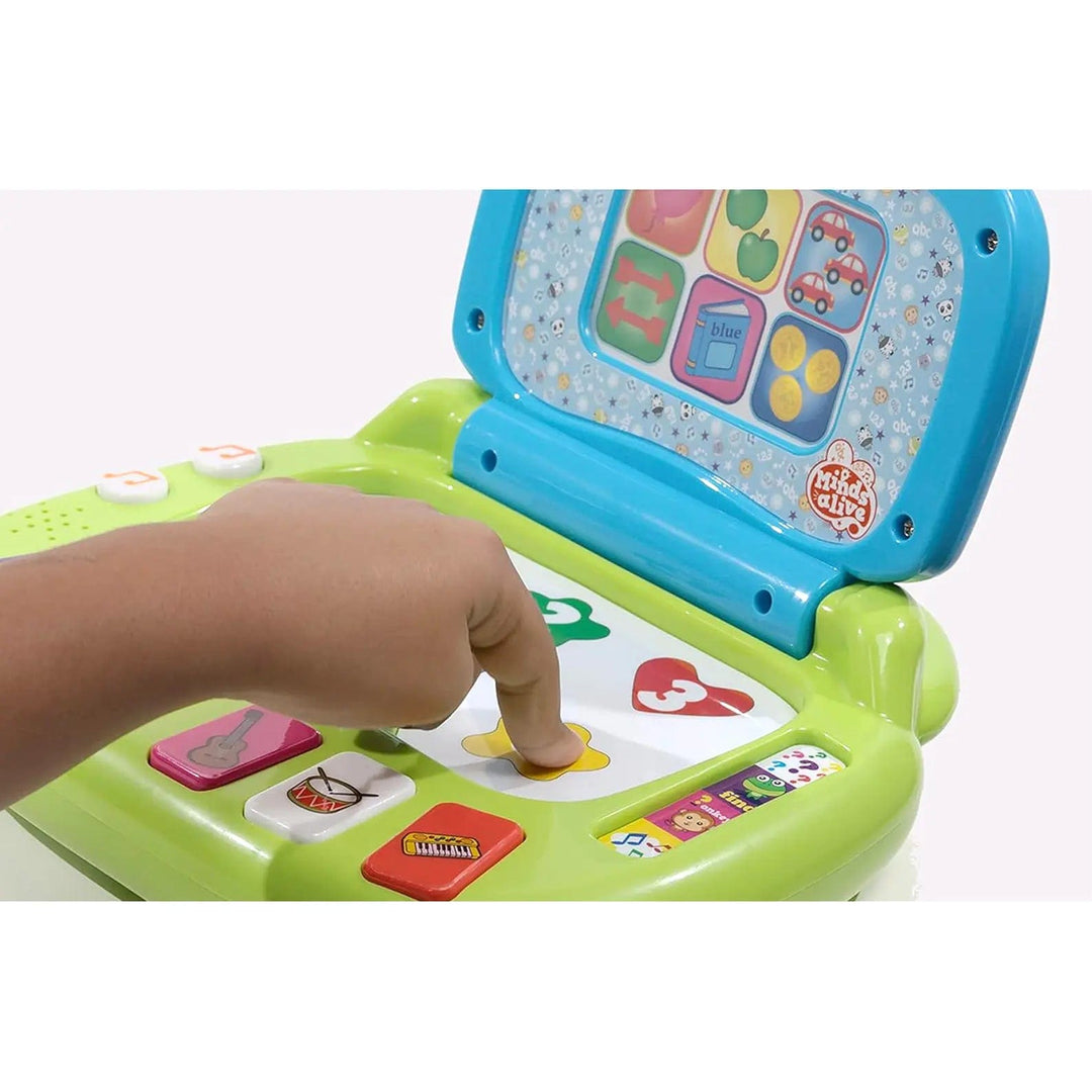 Childs finger pressing a button on an interactive laptop toy