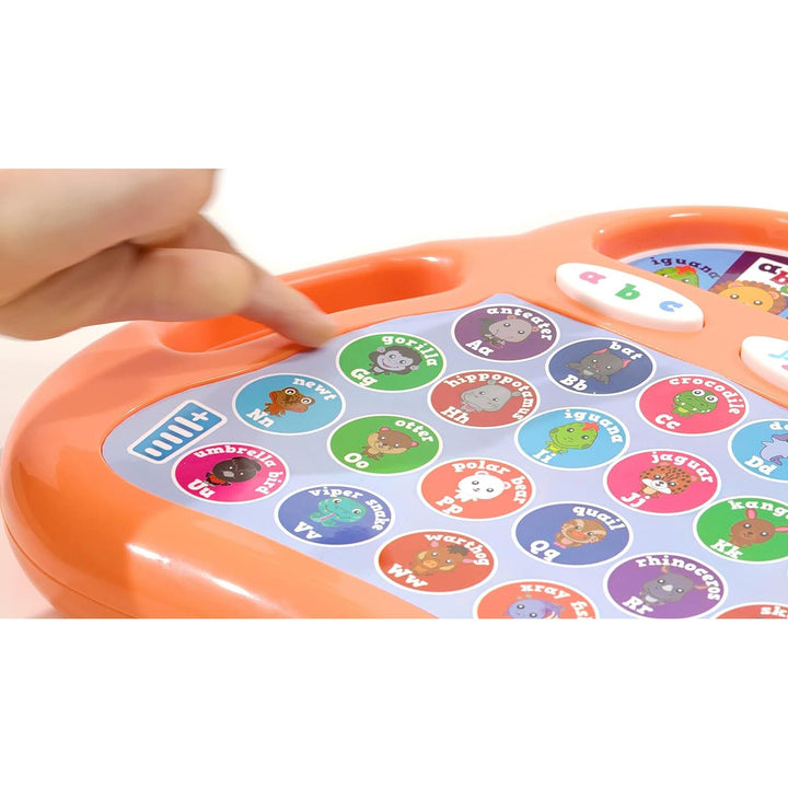 Childs finger pressing an alphabet button on a learning toy for age 3 years and over