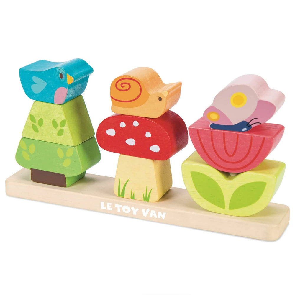 Wooden toy set with animal shapes on a base, featuring Le Toy Van branding.