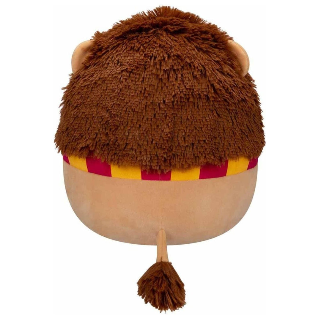 Plush lion toy with a striped scarf on a white background and tail with fluffy tip