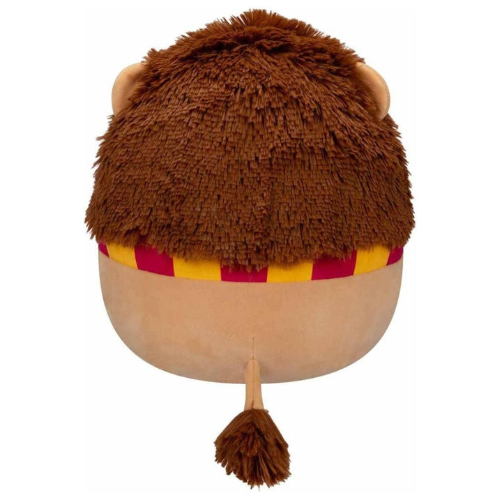 Plush lion toy with a striped scarf on a white background and tail with fluffy tip