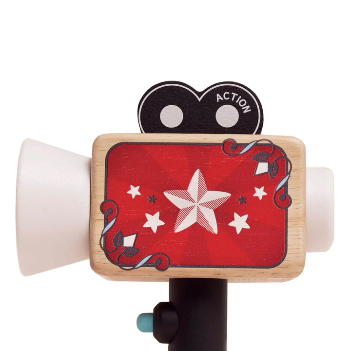 Toy camera with red side panel, white lens and black handle