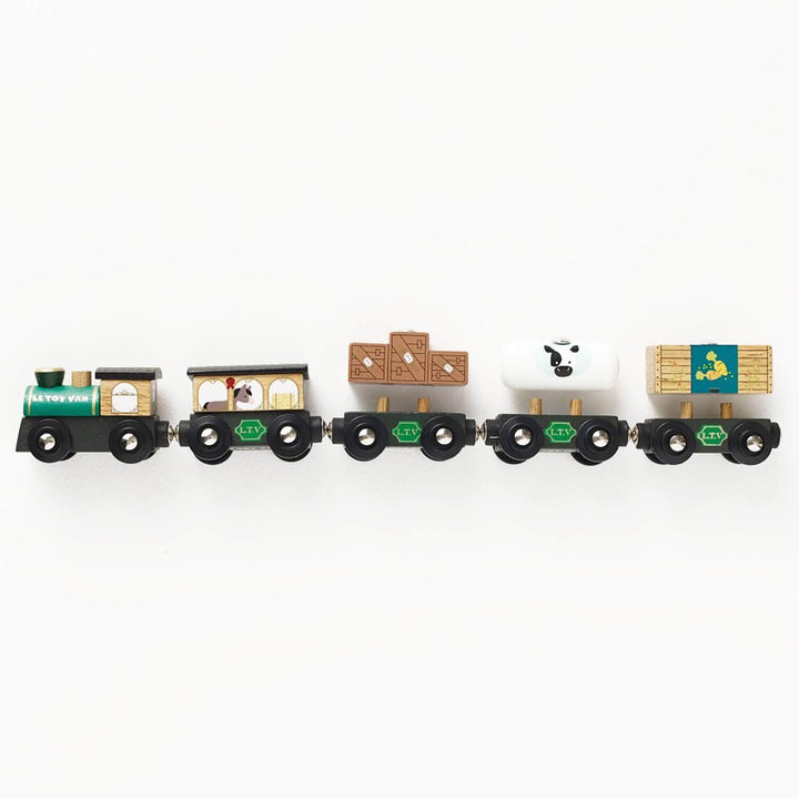 Farmyard theme green toy train set on a white background