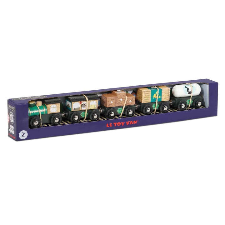 Set of toy train cars in a purple box with &