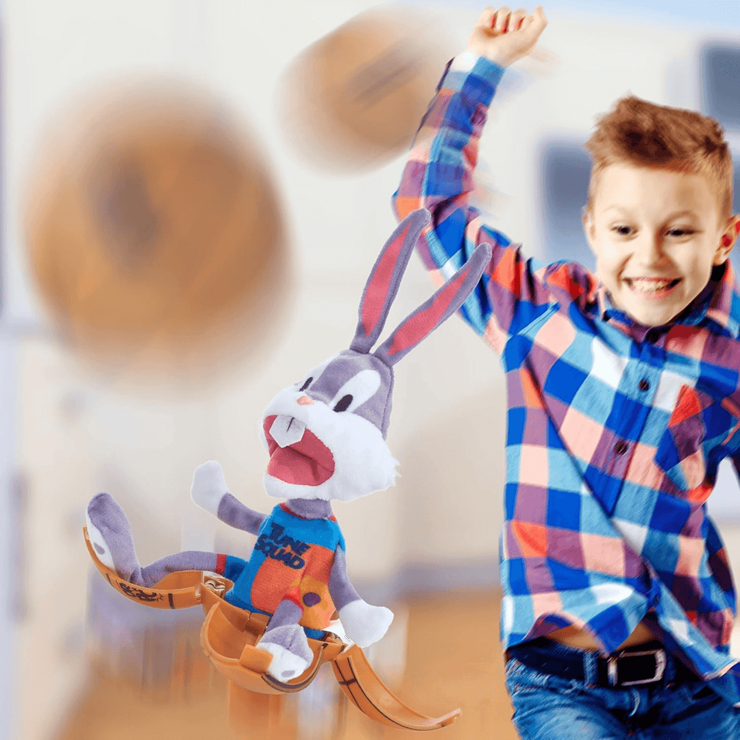 little boy watching bugs bunny hatch from his basketball, smiling