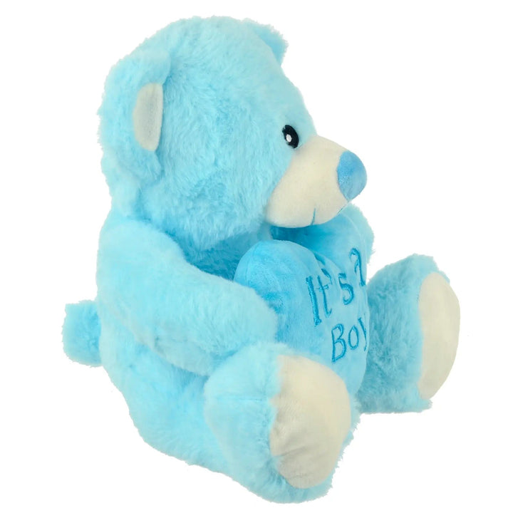 Side view of baby blue teddy bear holding a blue heart with it's a boy messgae