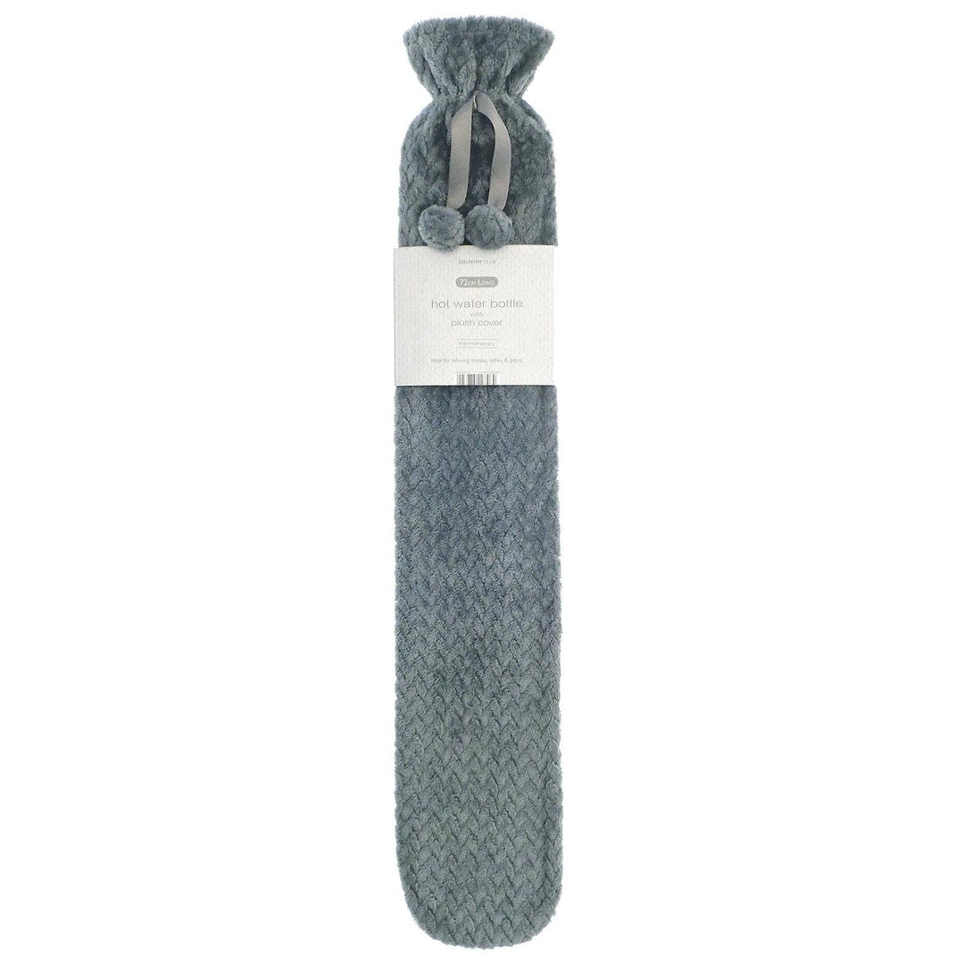 Long hot water bottle with grey fleece cover and pom poms