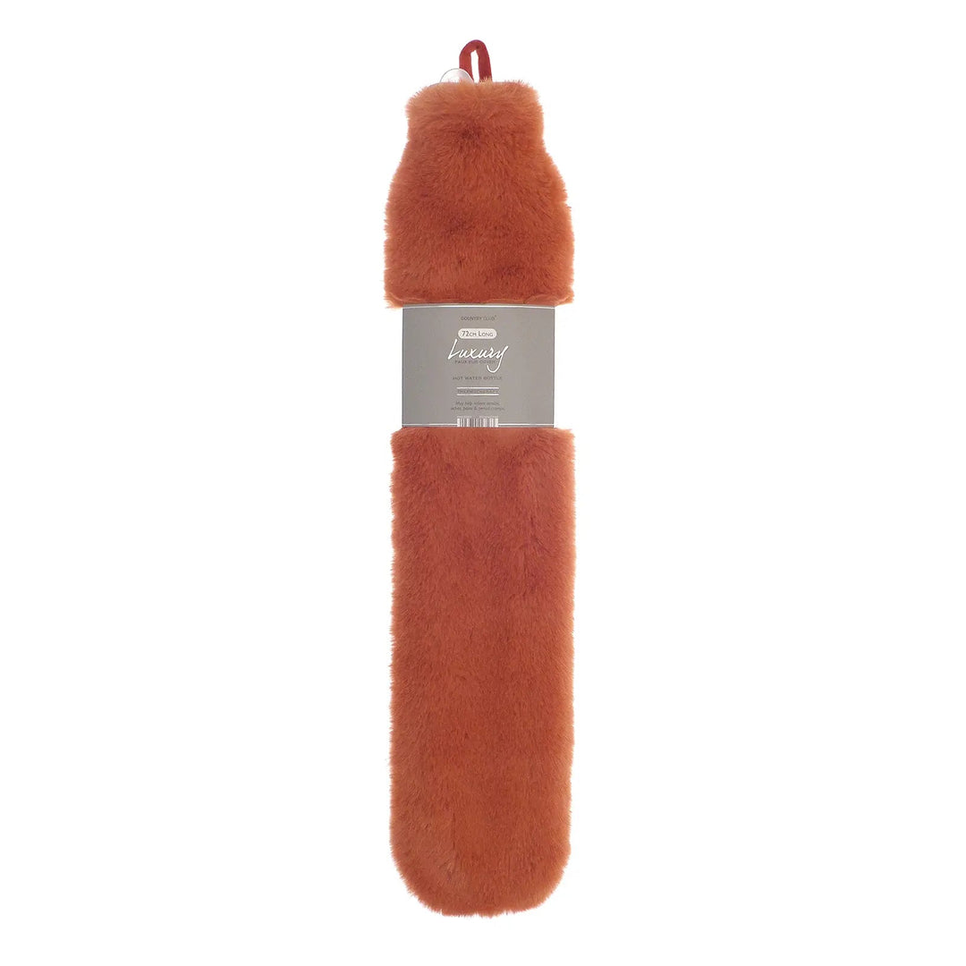 Long hot water bottle with orange faux fur cover and hanging loop