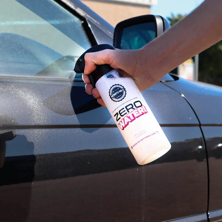 Person spraying Zero Water on a car for waterless cleaning