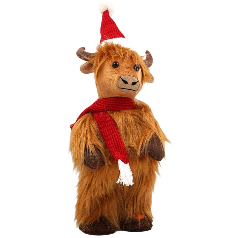 Plush Highland cow wearing a Santa hat and scarf on a white background