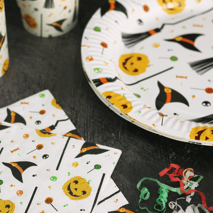 detail shot of 3-ply napkin on halloween table beside party streamers