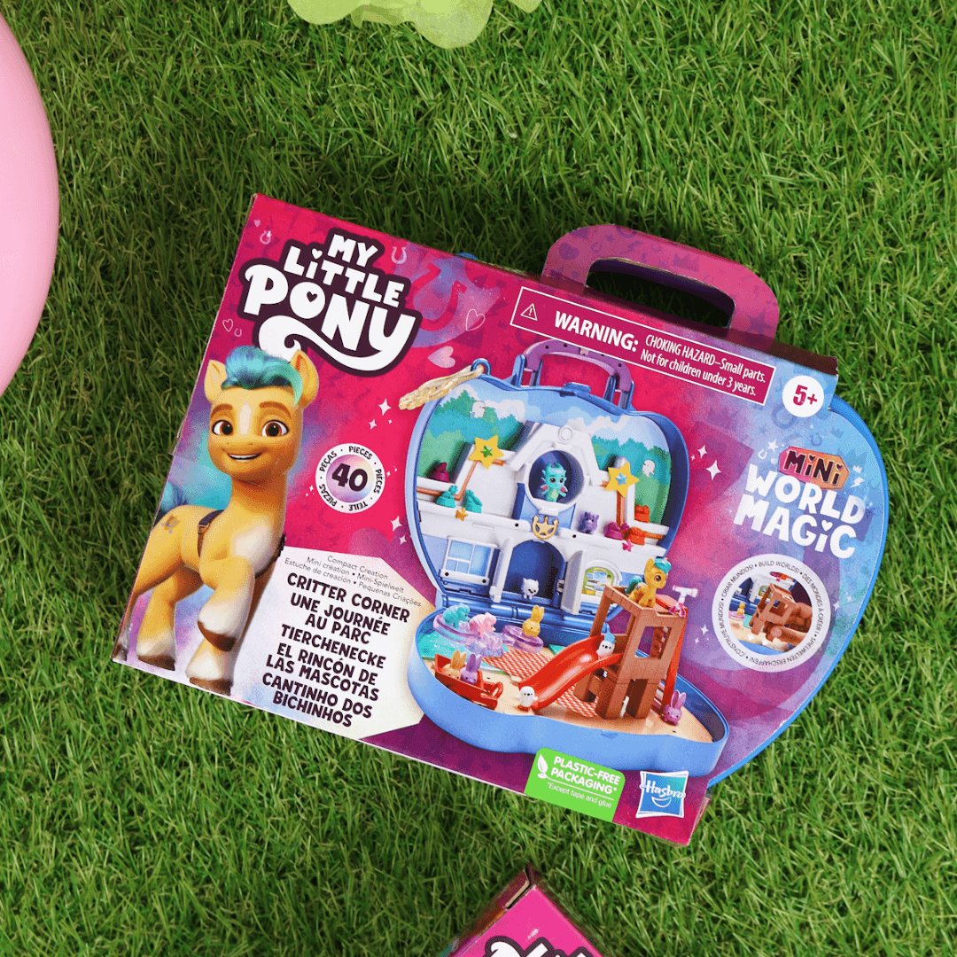 my little pony magic creations kit on grass with colourful balloons and decorations