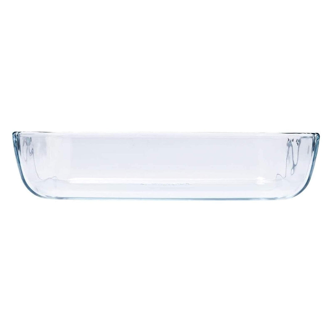 Side profile of a glass rectangular oven dish on a white background