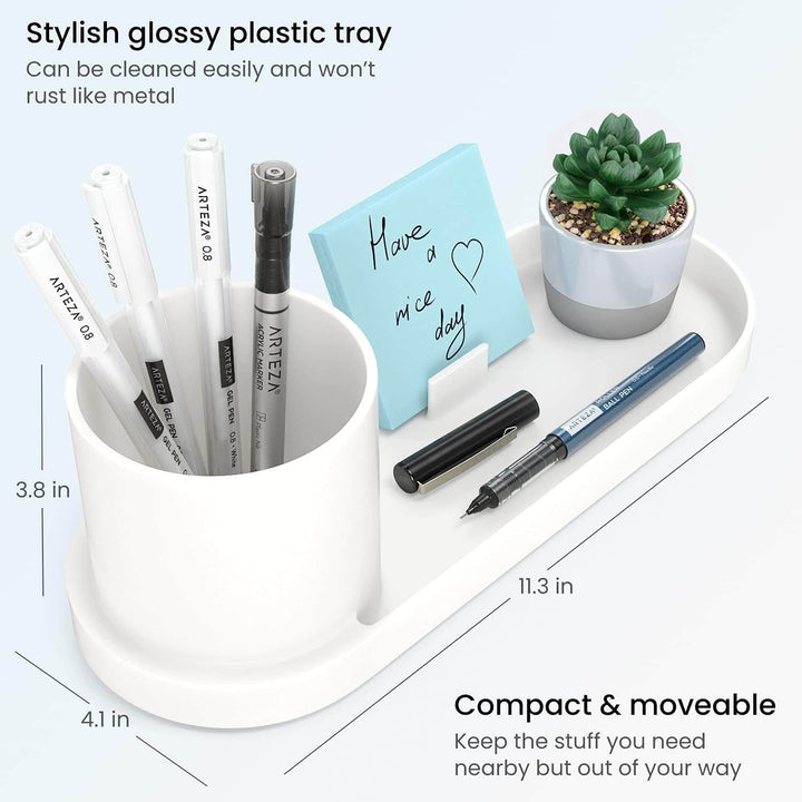 Desk organiser tray with pens, sticky post it notes and a small potted plant, with measurements