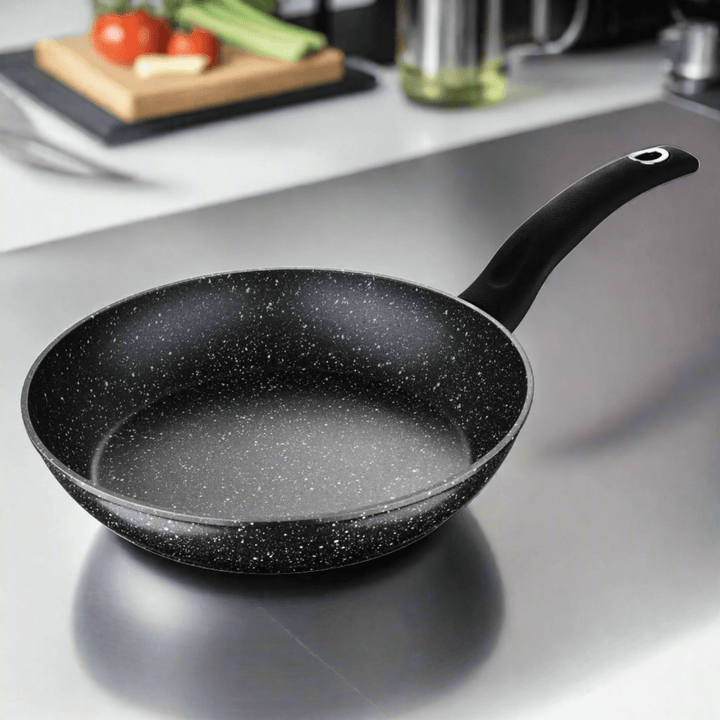 Large black frying pan with marble effect non-stick coating and chrome inset hanging hole on the handle