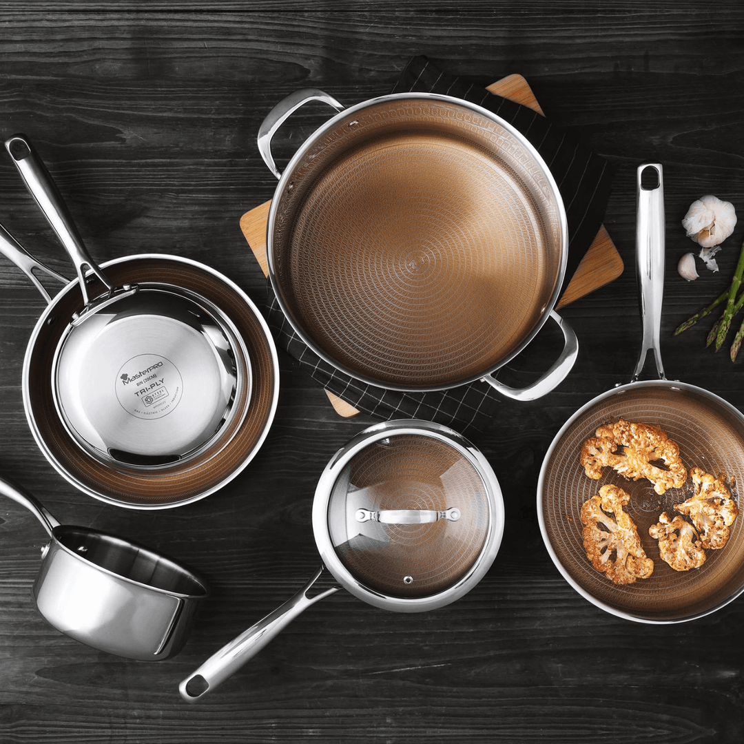 cooking set laid out on black worktip featuring ingredients in frying pan and to the side