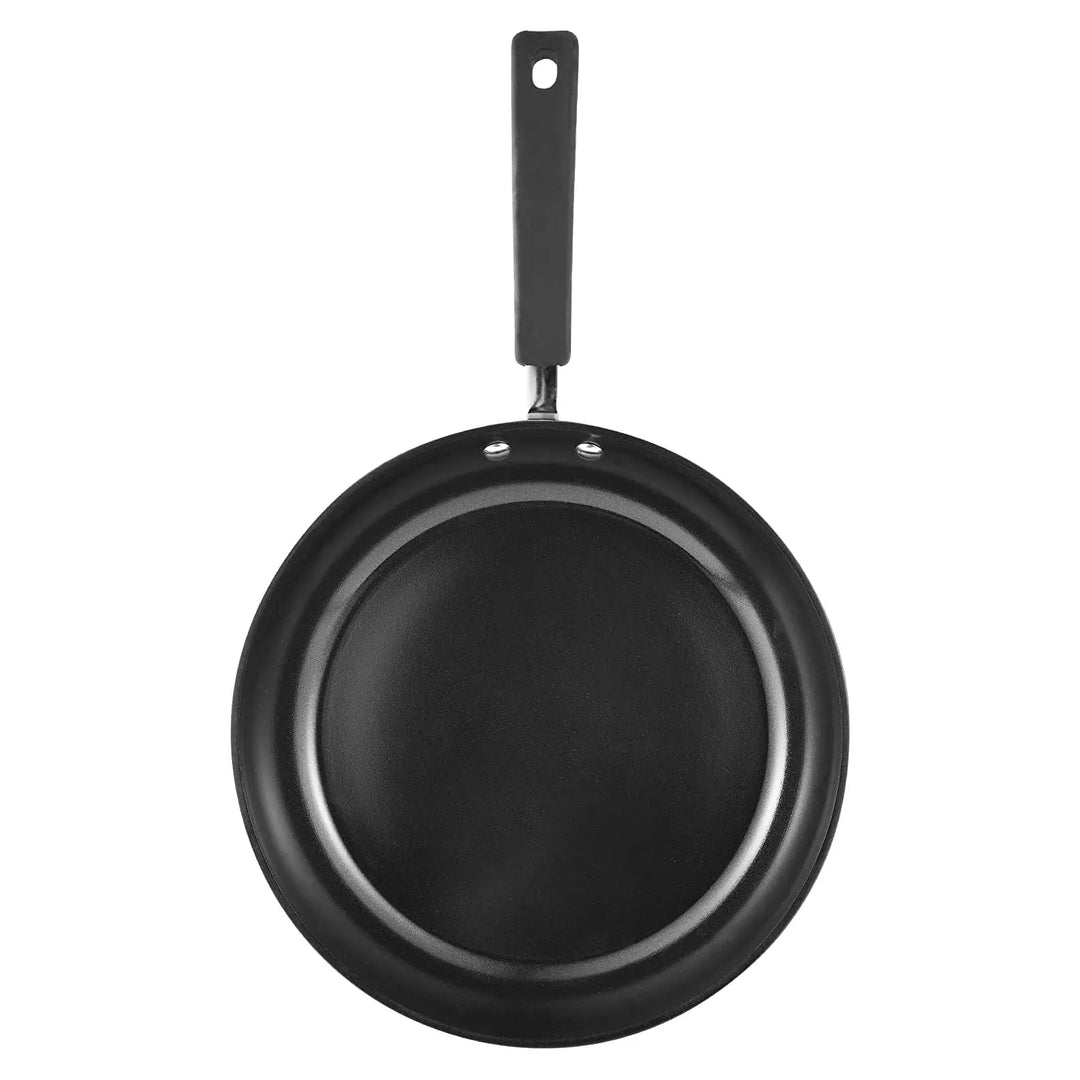 Overhead view of a black non-stick coated frying pan with black handle