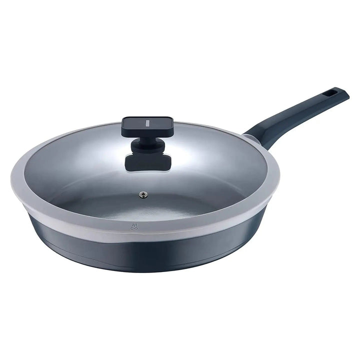 light and dark grey frying pan with glass lid