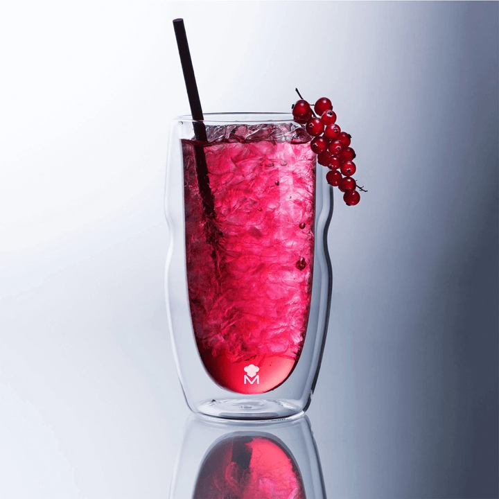 double walled shot glasses featuring pomegranate drink with mini black straw