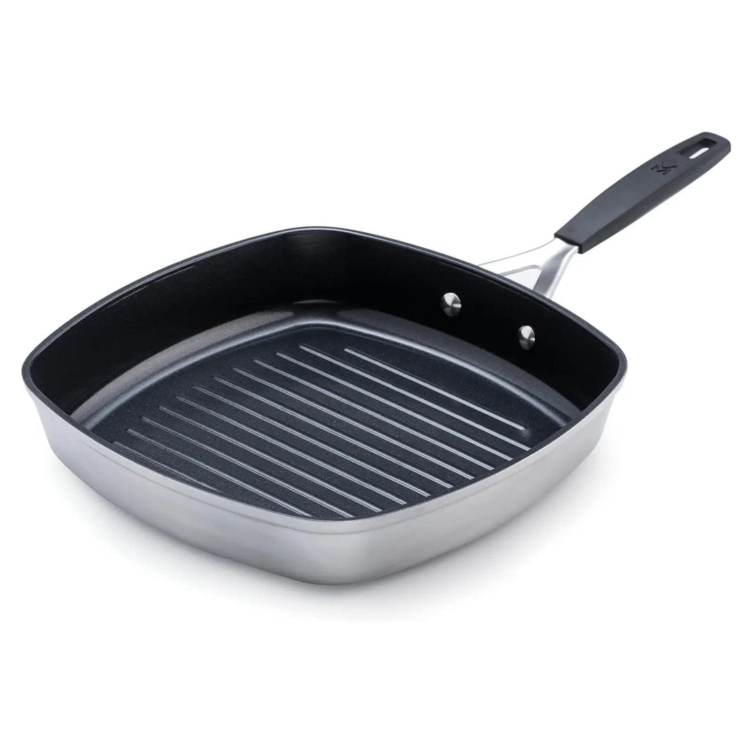 Black and silver grill pan with ridged surface and stay cool handle