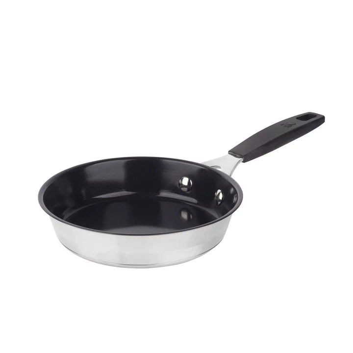 Small stainless steel frying pan with black non-stick interior and handle