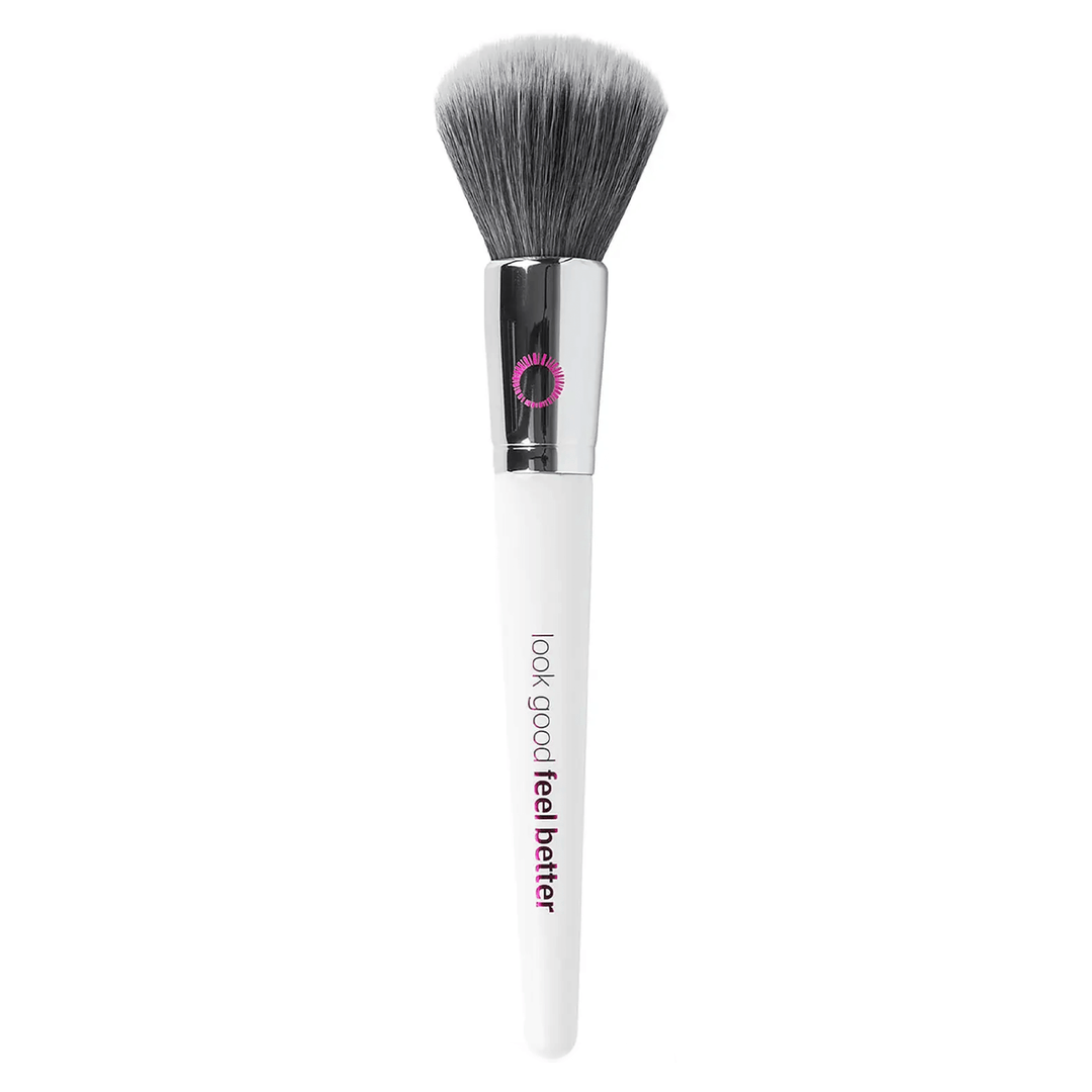 blush brush featuring synthetic bristles and white handle with pink embossed logo