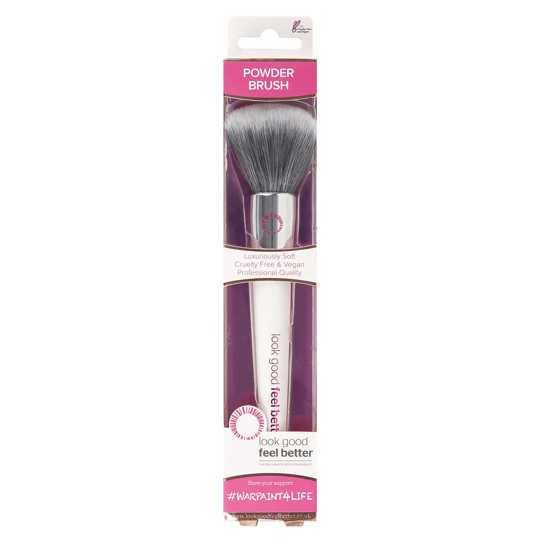 powder brush with white handle and pink embossed logo in pink and white cardboard packging