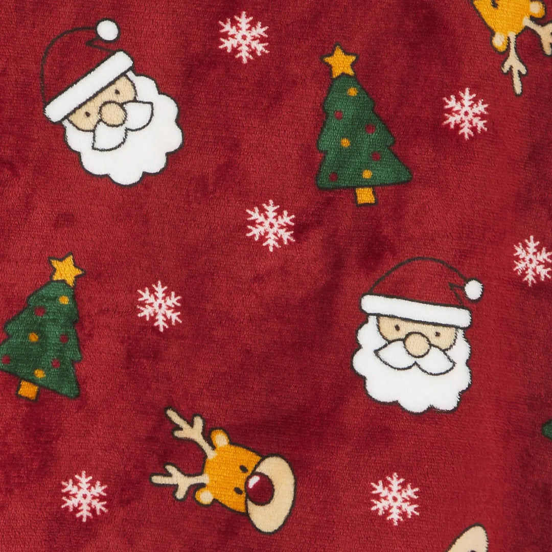 Close up of dark red Christmas hoodie blanket with Santa heads, reindeer, Christmas trees and snowflakes pattern