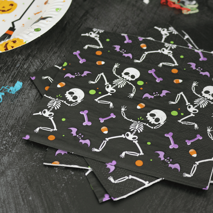 dancing skeleton napkins on black halloween table