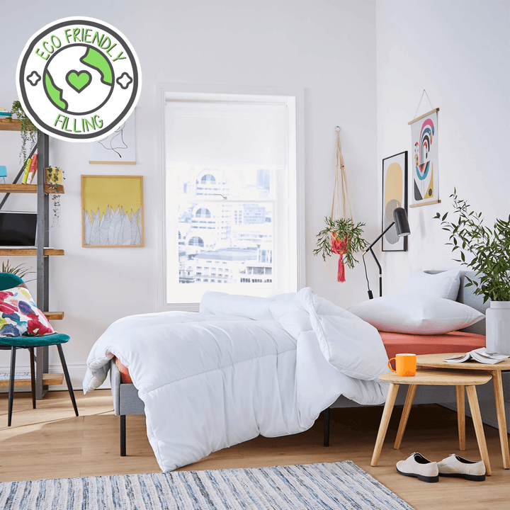 modern bedroom with a white comforter on a bed, &