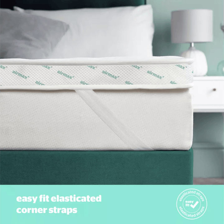 Bed with airmax elasticated corner straps on a teal bed frame