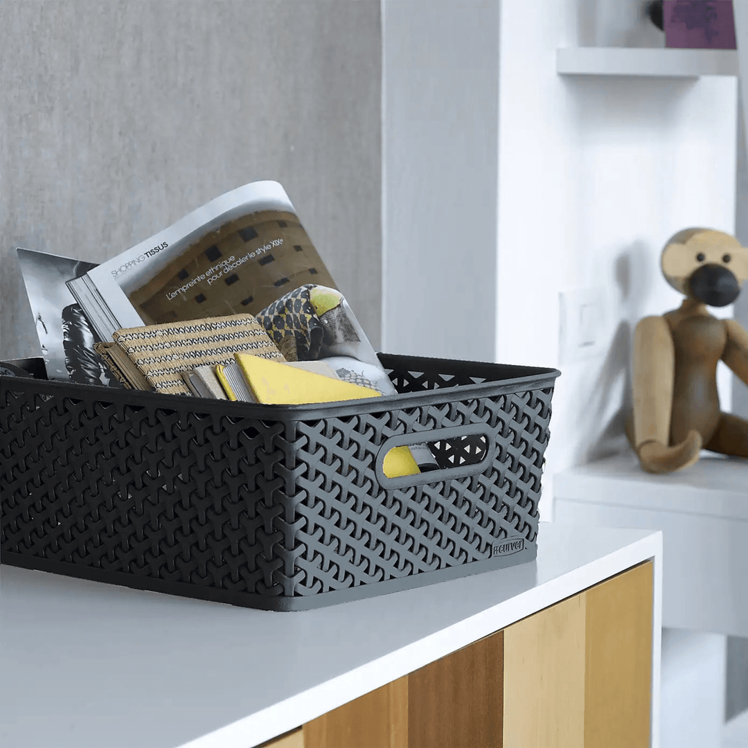 medium storage basket on bedroom counter with magazines and notebookes stored inside