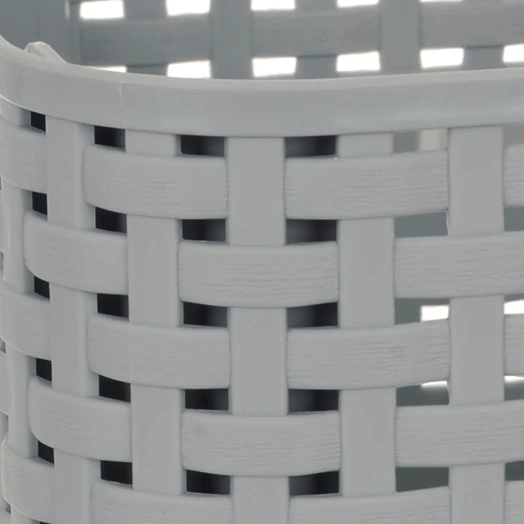 Close up of a woven design plastic grey storage basket for craft supplies