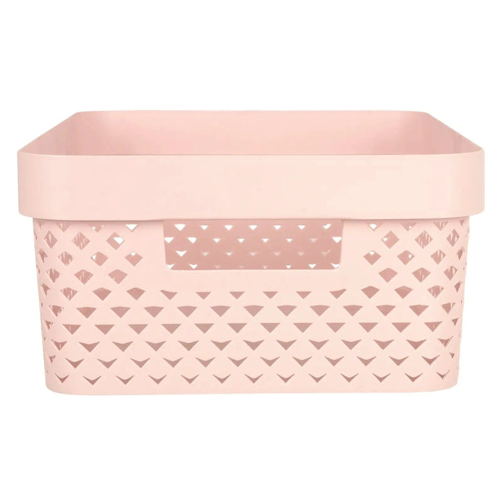 Side view of handle and pattern on a small pink Curver Pure storage basket