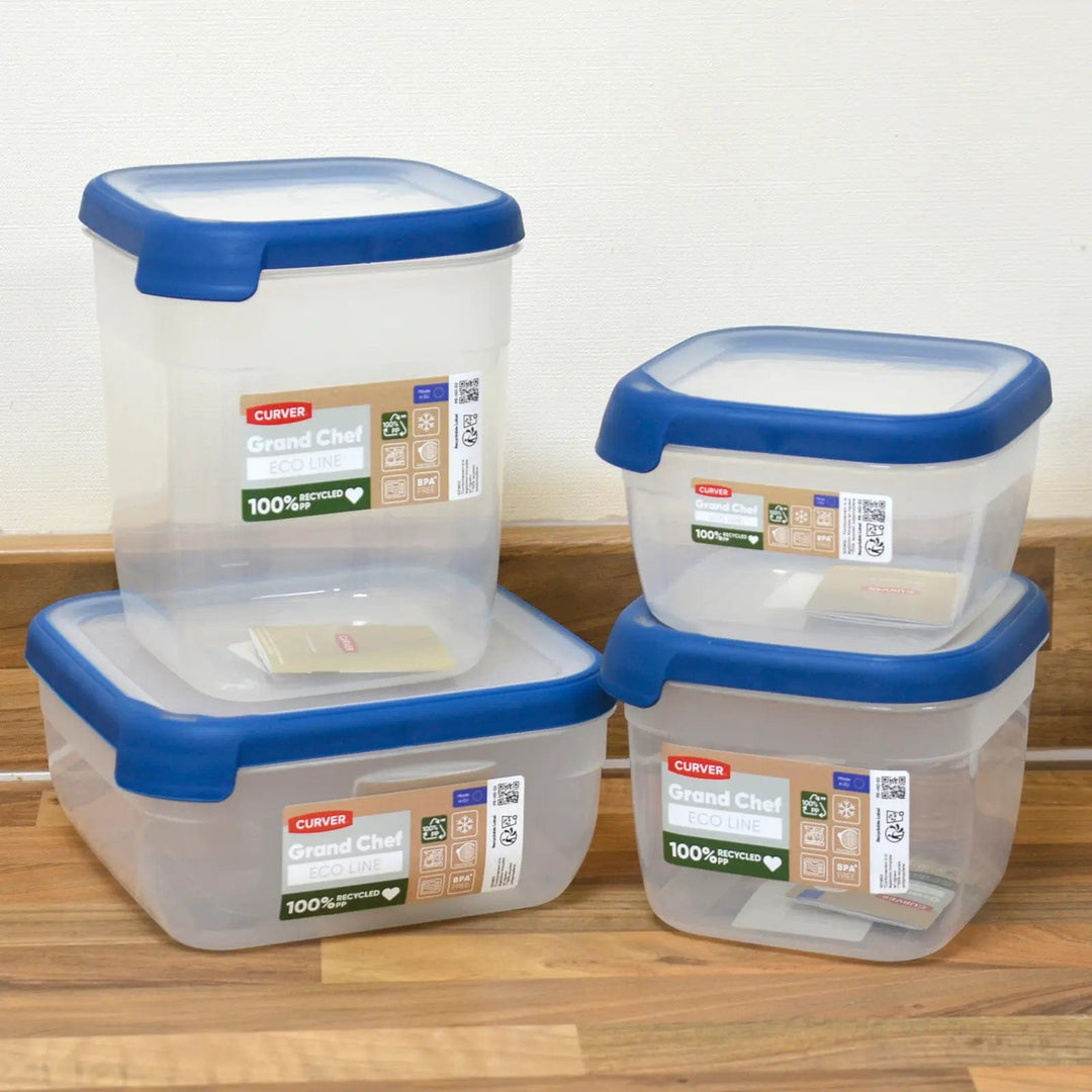 4 food storage boxes with clear container and blue sealing lid, stacked on a kitchen worktop