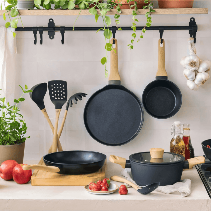 masterchef kitchen range featuring pancake pan hanging on kitchen rail with plants hanging from above and ingredients on kitchen counter