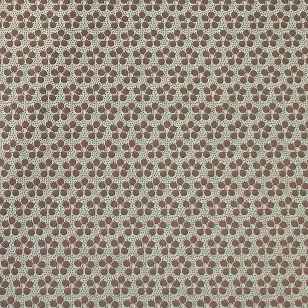 Detail of brown and grey floral pattern on a placemat