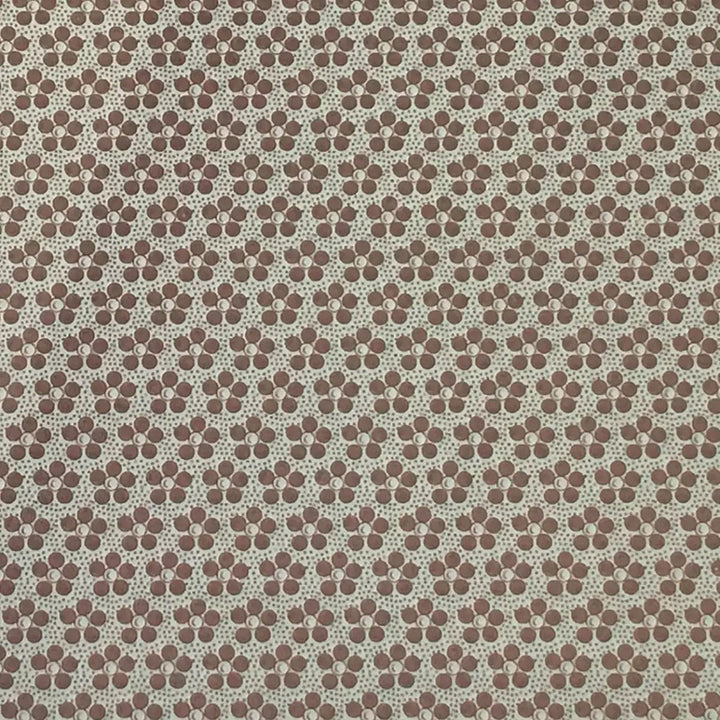 Detail of brown and grey floral pattern on a placemat