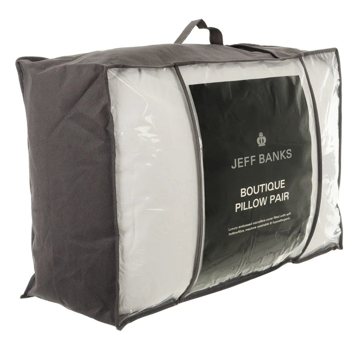 Side view of Jeff Banks boutique pillows in a carry and storage pack with handle