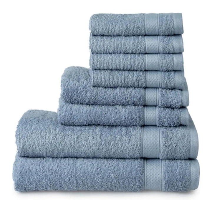 Dusty blue towels piled up, with 2 bath towels, 2 hand towels and 4 face cloths