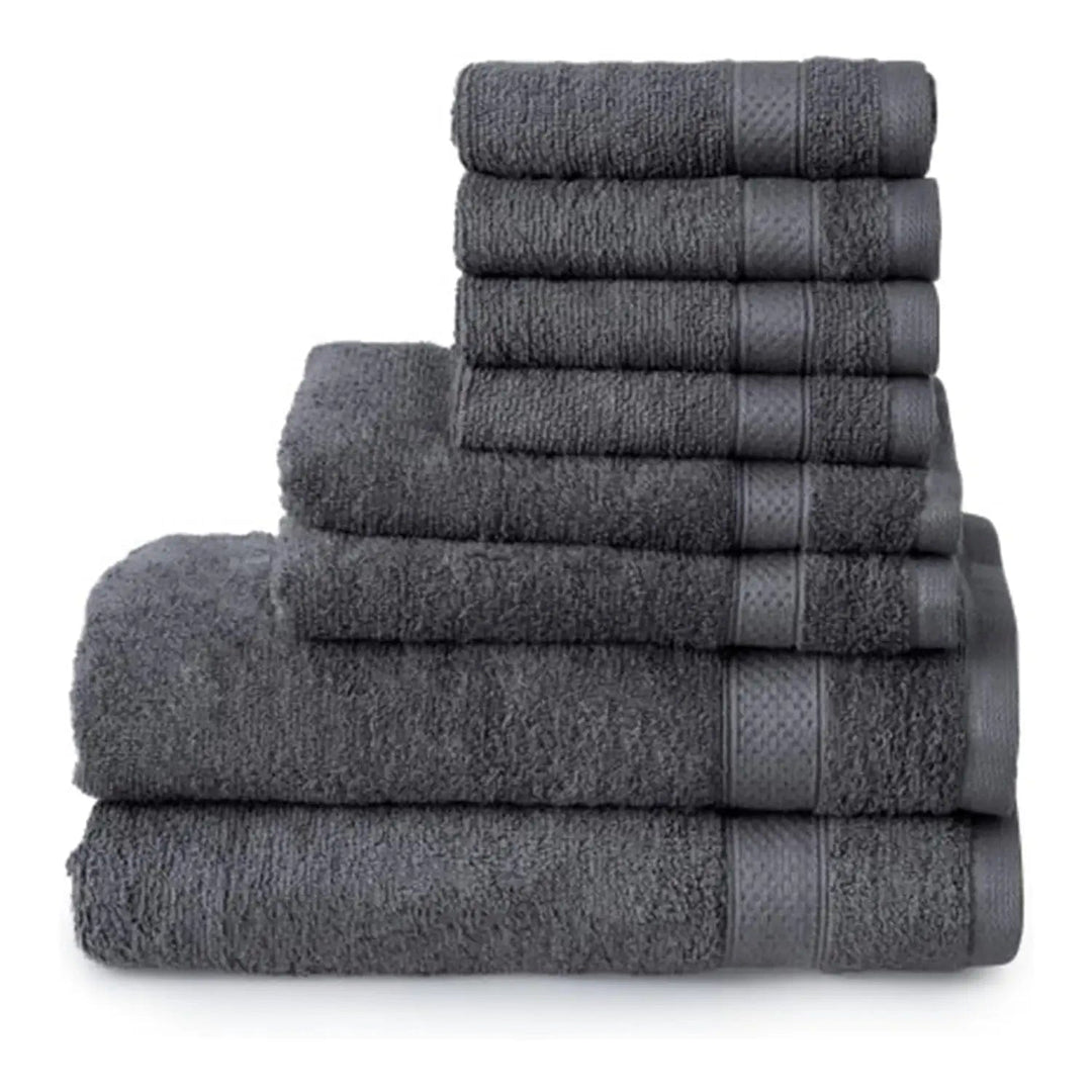 8 charcoal grey towels piled up, with 2 bath towels, 2 hand towels and 4 face cloths