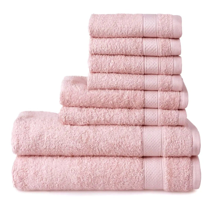 8 blush pink towels piled up, with 2 bath towels, 2 hand towels and 4 face cloths