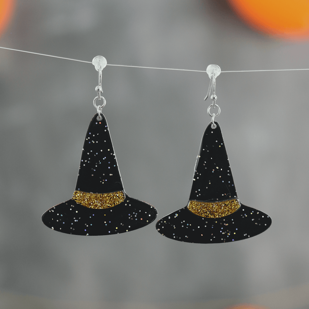 sparkly witches hat earrings on a black and orange background