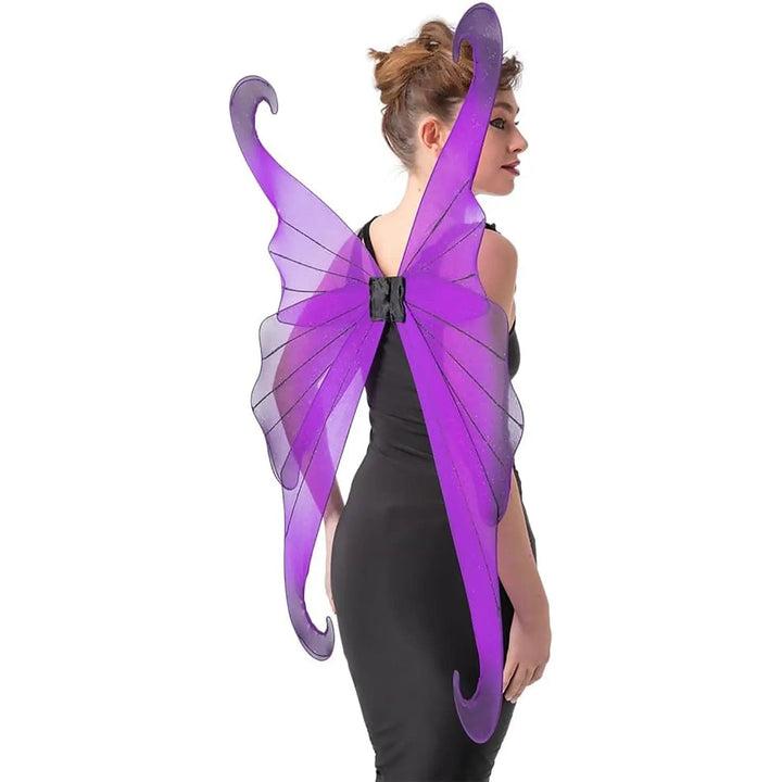 Side view of female model wearing large purple and black fairy wings with a black dress