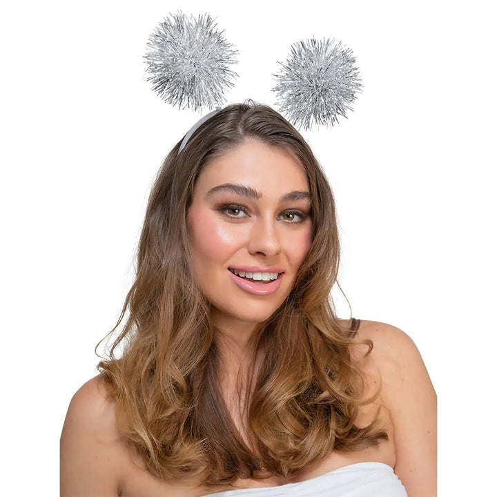 Lady wearing a headband with silver tinsel head boppers for Christmas parties