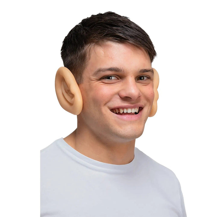 Man wearing a pair of large funny ears for fancy dress costumes