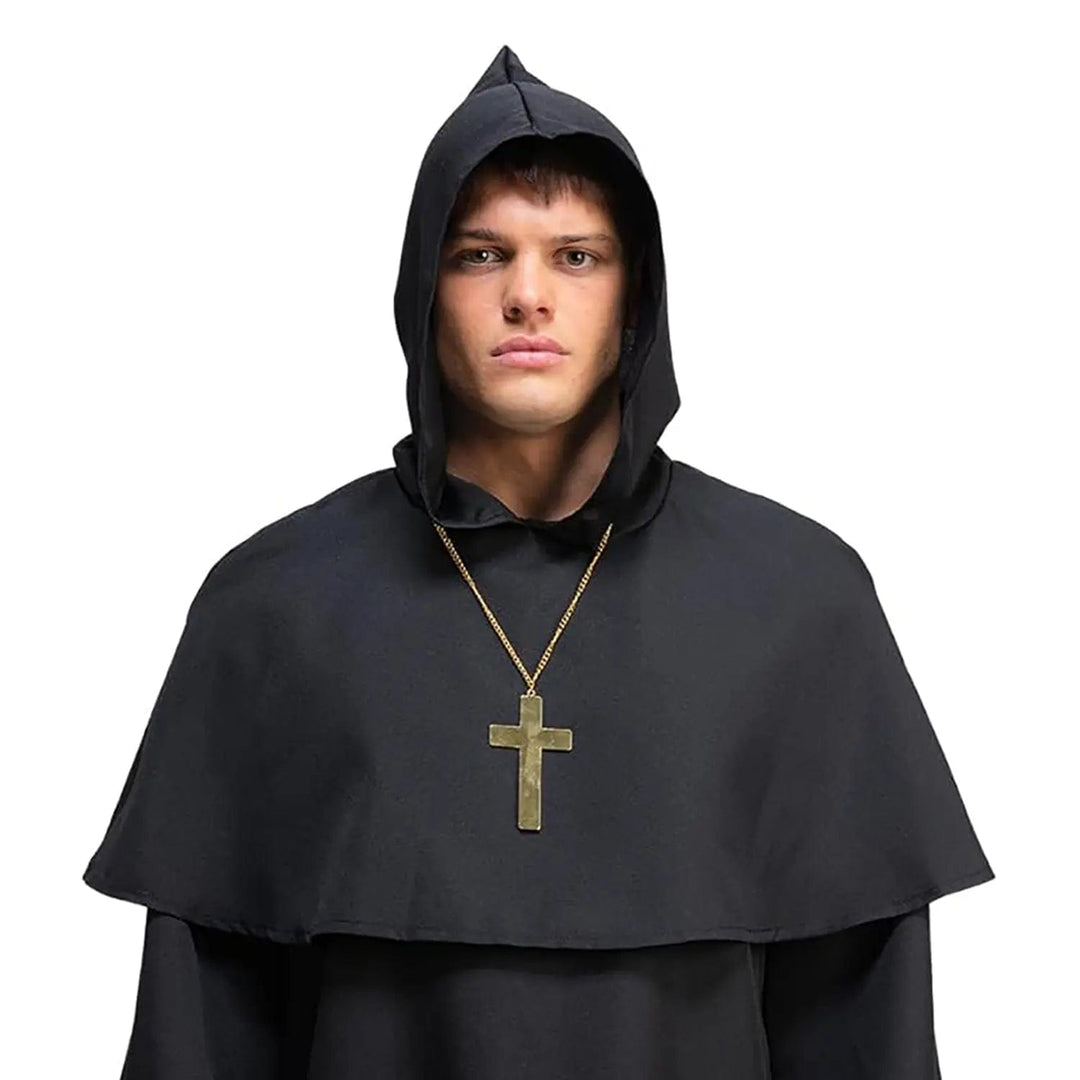 Man wearing a gold metal crucifix and black monk's robe for religious theme fancy dress parties