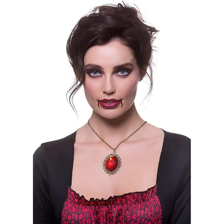 Lady wearing a large ruby jewel necklace for Vampire Halloween costumes